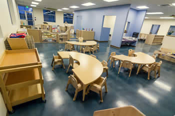half tables and chairs in the toddler room
