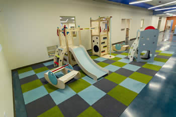play equipment with colorful rug